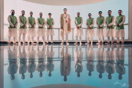 Photo of Groom portrait with coordinated groomsmen