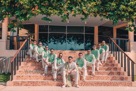 Photo of Groom with coordinated groomsmen