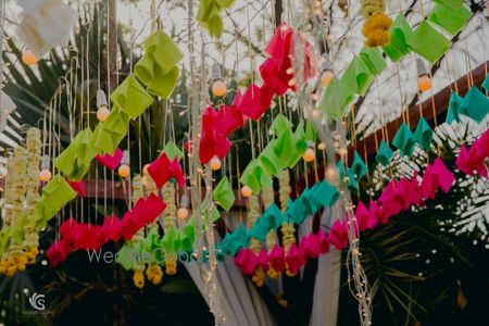 Photo of Mehendi decor idea with hanging origami