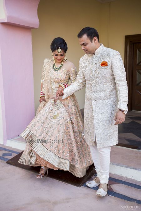 Photo of Bride in light peach girly engagement lehenga