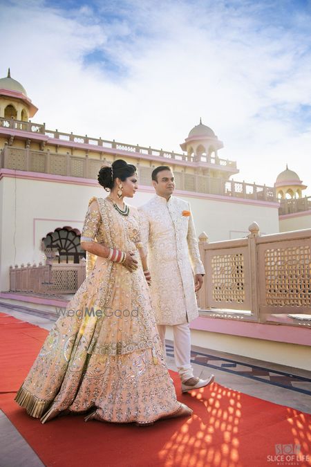 Photo of Bride in light peach engagement lehenga