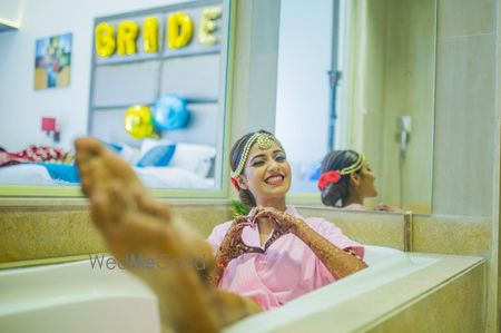 Photo of Bride in bathtub getting ready photo idea