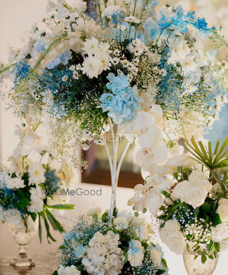 Photo of Bridgerton themed event florals in white and blue