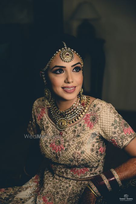 Photo of Bride getting ready shot in beige lehenga