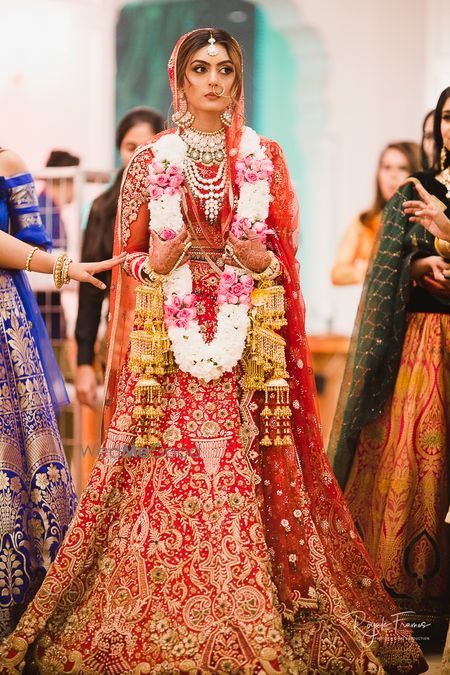 Photo of Red and gold embroidered bridal lehengas