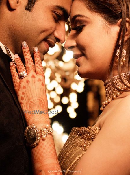 Photo of Couple portrait showing off engagement ring