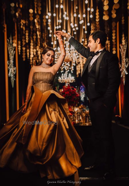 Photo of Gold ruffled cocktail gown for sangeet