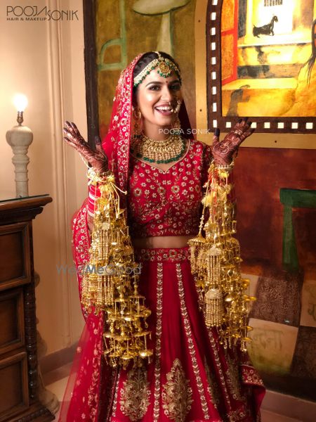 Photo of Bride in red happy wearing kaleere