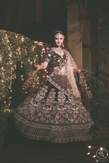 Photo of Velvet maroon bridal lehenga twirling