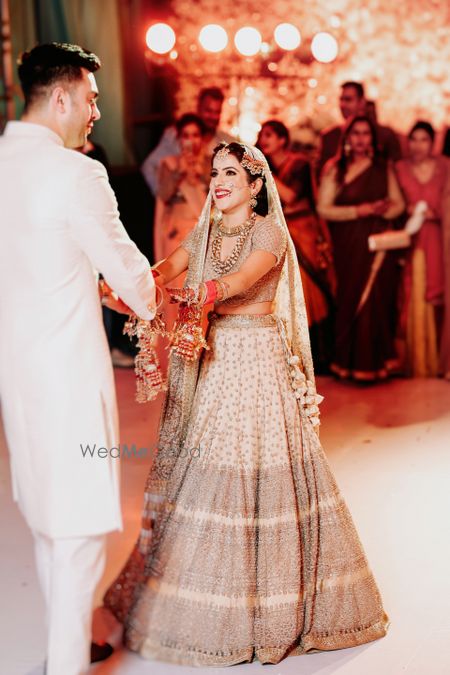 Photo of Happy bride and groom dancing shot