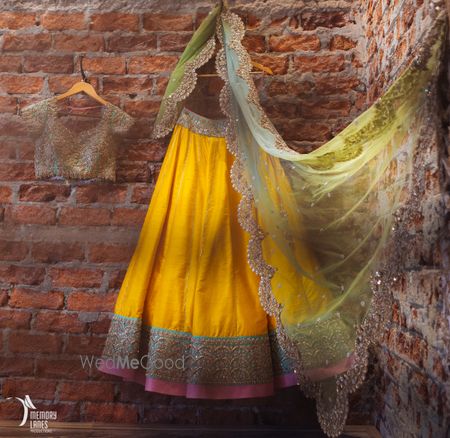 Photo of yellow ad blue and pink lehenga