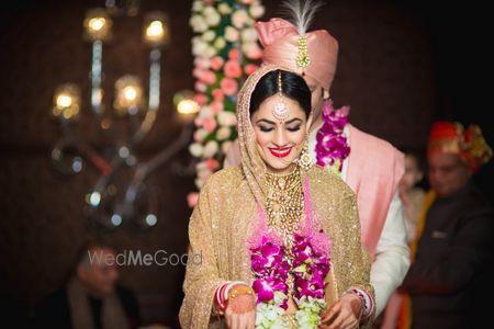 Photo of Bride Wearing Var Mala Shot