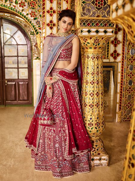 Photo of Maroon anita songre lehenga with matching bag