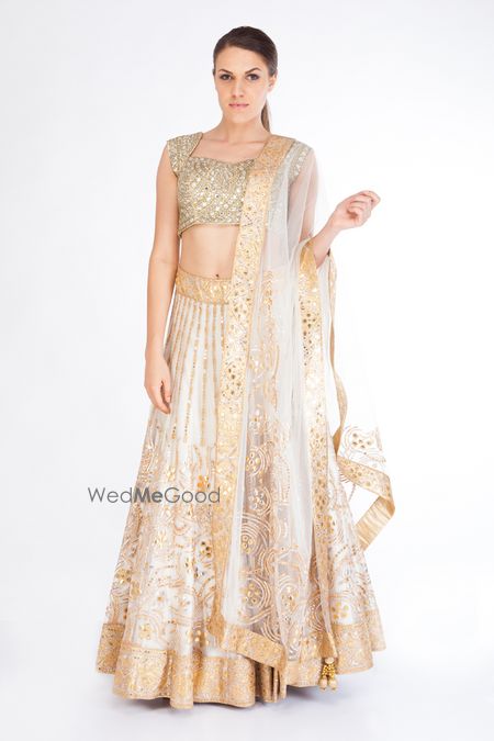 Photo of white and gold lehenga