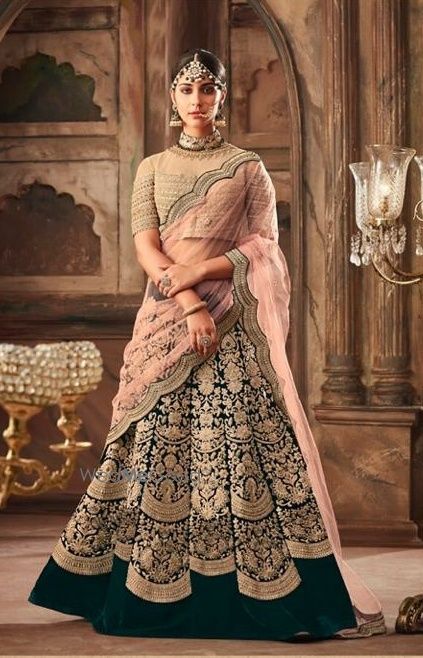 Photo of Pretty dark green and pink lehenga for an Indian wedding