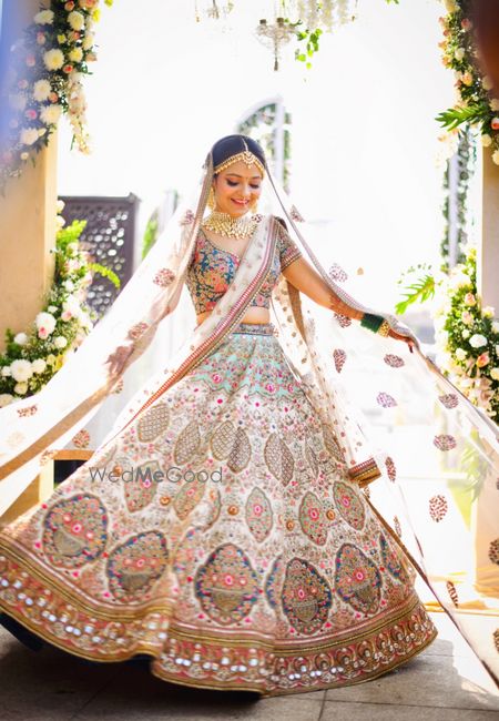 Photo of Offbeat white and blue bridal lehenga