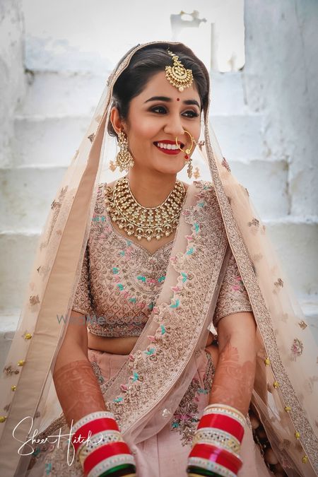 Photo of Pastel bride in blush pink lehengas