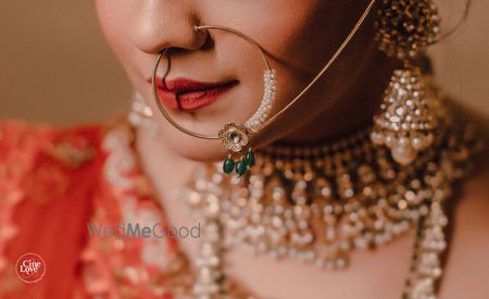 Photo of Bridal Nath with green beads close up shot