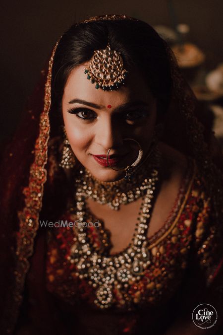 Photo of Bride in red close up shot with shadow