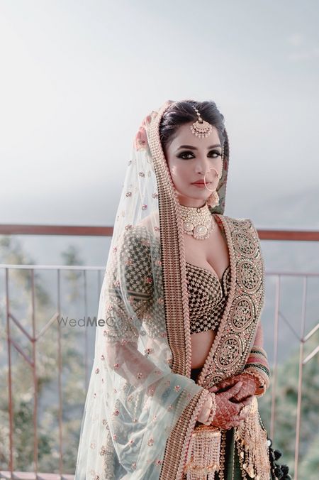 Photo of Teal bridal sabya lehenga with smokey eyes