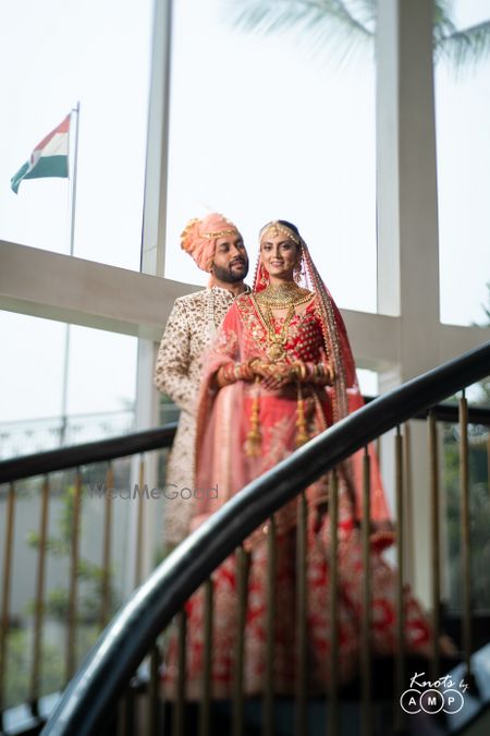 Photo of Bride and groom portrait on staircase