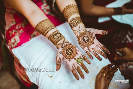 Photo of Modern bridal mehendi design with monograms