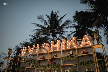 Photo of Cocktail bar decor idea with lit up wedding hashtag