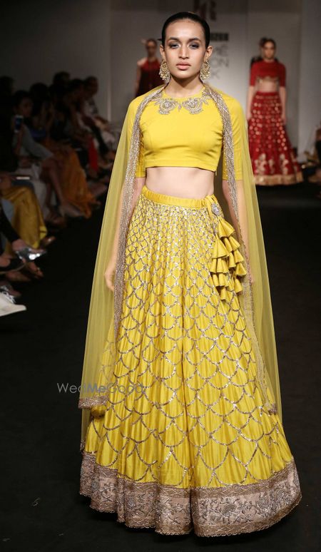 Photo of yellow lehenga closed neck blouse