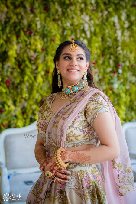 Photo of Mehendi bridal look with bright blue enamel jewellery