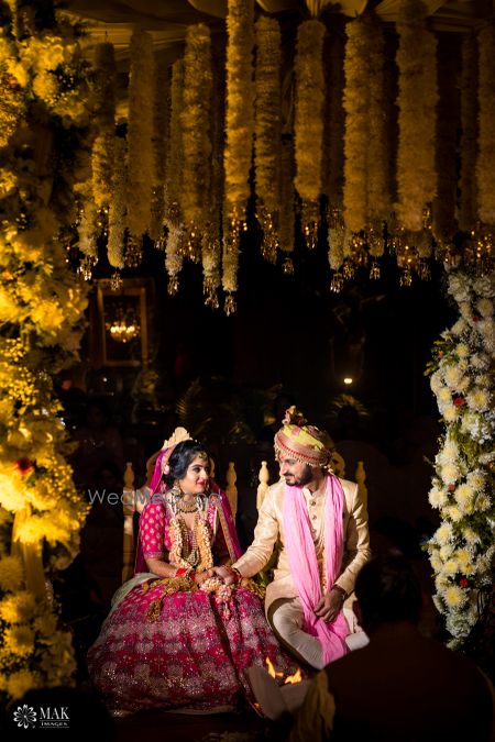 Photo of Couple portrait inside mandap before pheras