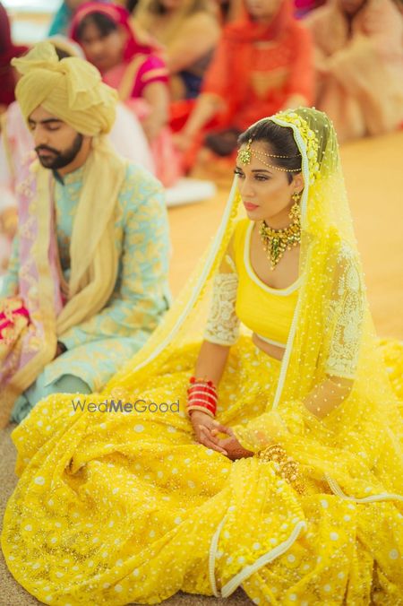 Photo of Bright yellow wedding lehenga for bride