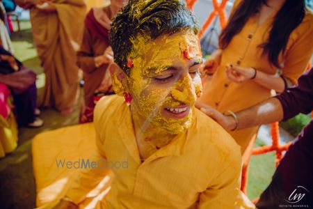 Photo of A smiling groom on his Haldi.