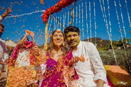 Photo of fun haldi couple portrait