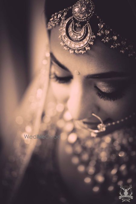 Photo of Sepia tone bridal portrait with mathapatti