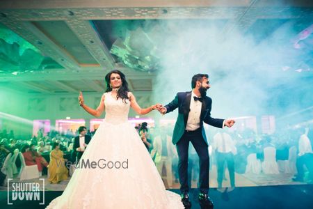 Photo of couple dancing shot on cocktail or sangeet