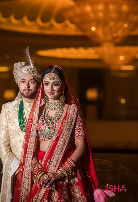 Photo of couple portrait on wedding day with bride wearing long rani haar