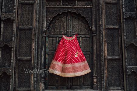 Photo of Red Bridal Lehenga on a Hanger