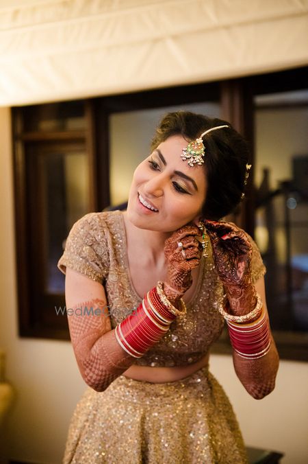 Photo of Bride Wearing Jewelry Shot