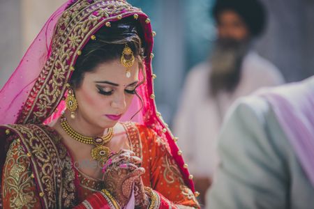 Photo of Pink Bride Praying Shot