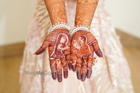 Photo of Mehndi design with a guy proposing to a girl.