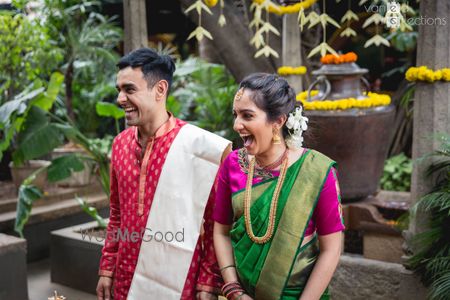 Photo of Couple laughing on their wedding day.