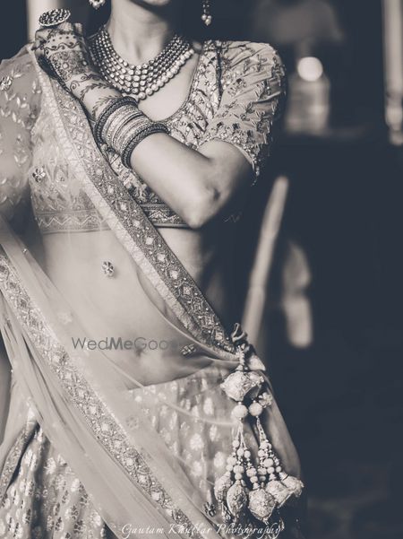 Photo of Bride Pinning Dupatta Shot