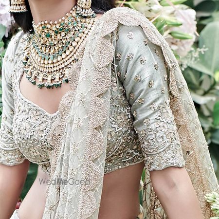 Photo of sage blouse with heavy green bridal set