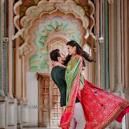 Photo of Twirling shot of a couple during their pre-wed shoot