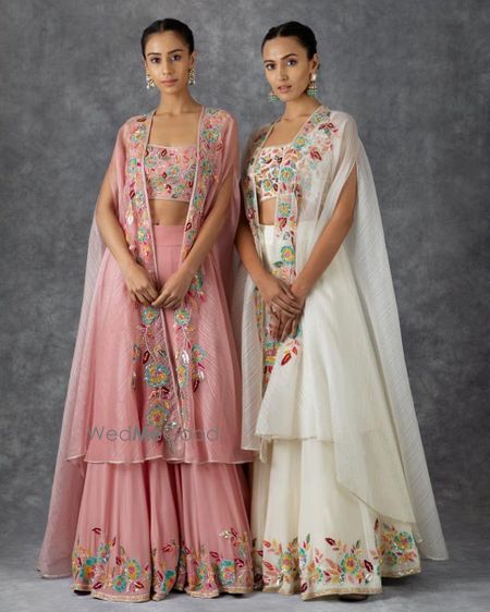 Photo of Whit and Pink lehengas with cape style dupatta. Suits well for gromm's or bride's sister.