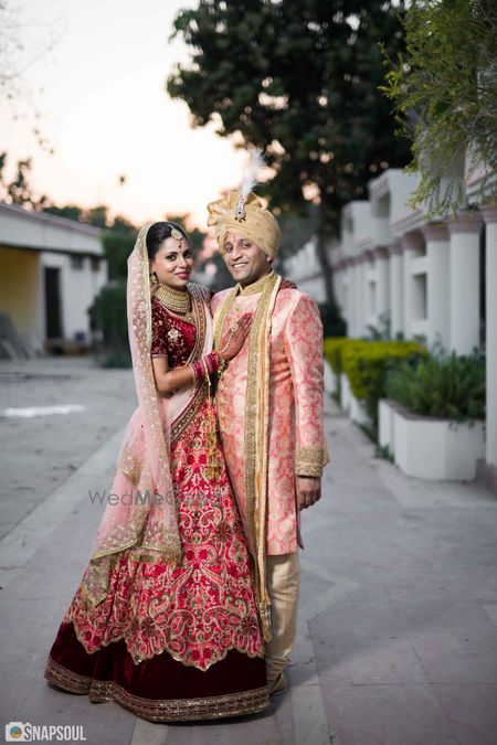 Photo of Wedding day couple portrait with contrasting outfits