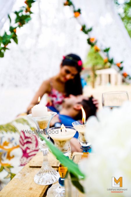 Photo of picnic pre wedding shoot with wine glasses