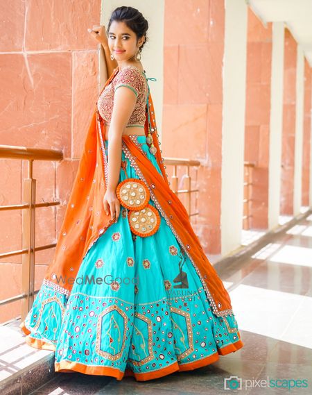 Photo of Turquoise and Orange Lehenga