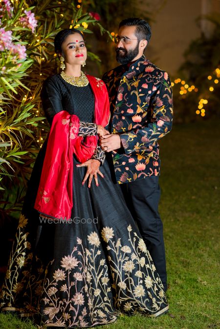 Photo of Bride and Groom in Black and Floral Prints