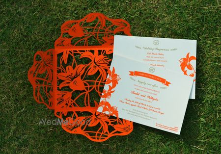 Photo of red laser cut invites